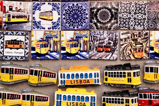 Lisbon, Portugal- March 14, 2019: Colorful magnet tram and tiles souvenirs of Lisbon city. Word Lisbon written.