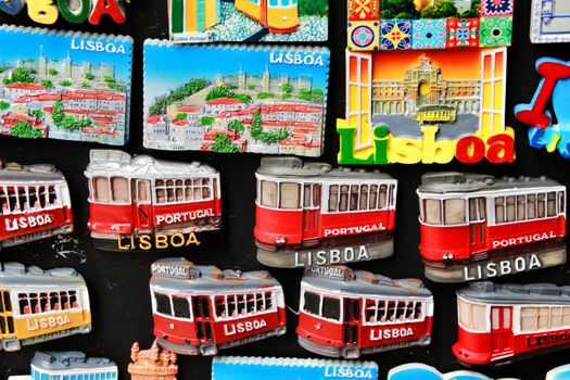 Lisbon, Portugal- March 14, 2019: Colorful magnet tram and tiles souvenirs of Lisbon city. Word Lisbon written.