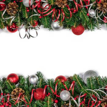 Christmas border frame design copmosition of fir tree branch and red silver decorations balls baubles ribbon pine cones isolated on white background