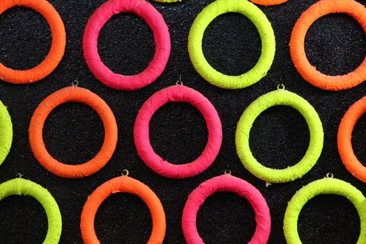 Colored rings in a row on black panel to practice dart shooting