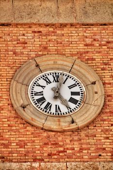 Antique clock in church tower in Altea square, Alicante, Spain