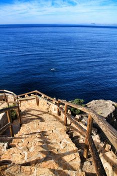 Beautiful beach with boats , cliffs and mountains in La Azohia village in Cartagena, Murcia, Spain in a sunny day. Views from Santa Elena tower viewpoint.