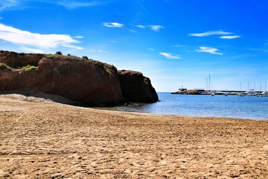 Beautiful La Ermita beach in Mazarron, Murcia, Spain. Island in the background.