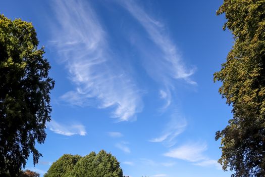 Stunning cirrus cloud formation panorama in a deep blue summer sky seen over Europe