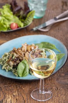 white wine and bavarian spaetzle on wood