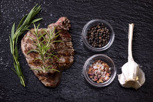 grilled steak on black slate