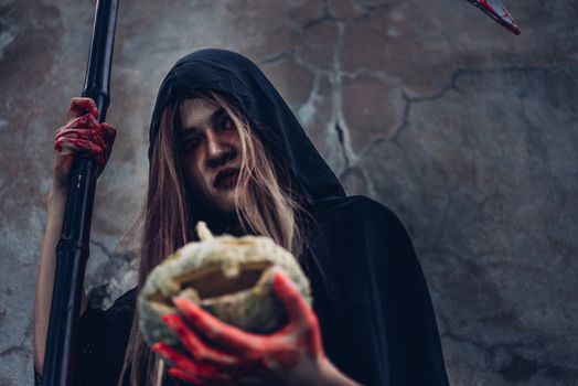 Woman ghost horror holding pumpkin her have blood on hand, halloween day concept