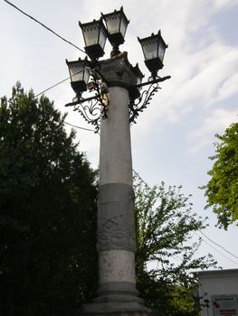 post with four lanterns in the old style. post with four lanterns in the old style.