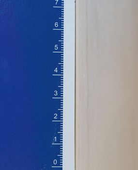 paper ruler with metric units in white over blue