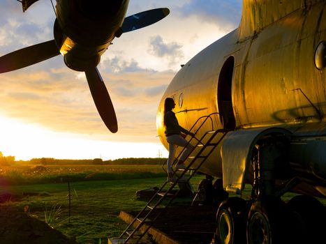 old Soviet military airplane, sunset time. Abandoned Historic Aircraft. Close up of propeller engine. Copy space