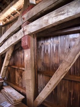 Close Up View of the Burr Arch Truss of a Restored Old 1844 Covered Bridge on a Sunny Day 