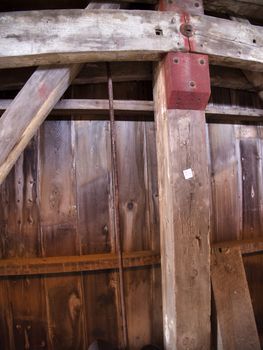 Close Up View of the Burr Arch Truss of a Restored Old 1844 Covered Bridge on a Sunny Day 