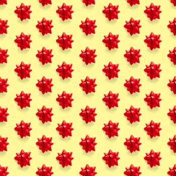 Seamless regular creative Christmas pattern with New Year decorations on yellow background. xmas Modern Seamless pattern made from christmas decorations. Photo quality pattern for fabric, prints, wallpapers, banners or creative design works.