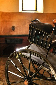 Old carriages in a house in Cordoba, Spain