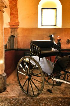 Old carriages in a house in Cordoba, Spain