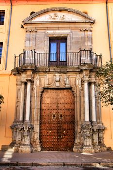 Colorful and majestic old house facade in Cordoba, Spain in a sunny day of winter