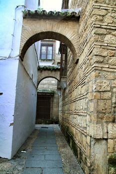 Narrow streets and majestic facades in Cordoba city, Spain.