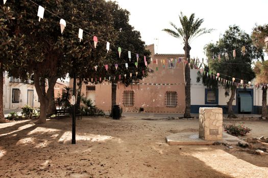 Streets of Tabarca Island in Alicante adorned by the festivity of the Virgen del Carmen