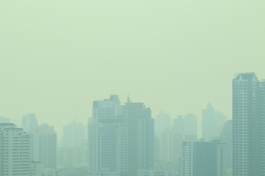 smog city in summer, haze of pollution covers city, global warming concept
