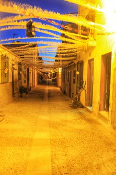 Streets of Tabarca Island in Alicante adorned by the festivity of the Virgen del Carmen