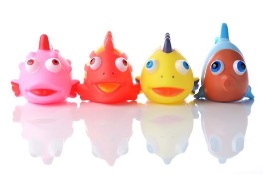 colorful rubber fish bath toy set on white background