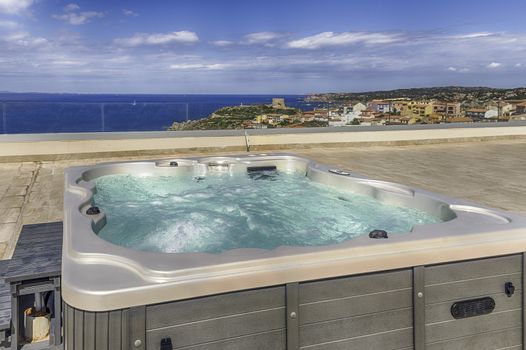 Modern luxurious pool with hydromassage overlooking the town of Santa Teresa Gallura, located on the northern tip of Sardinia in the province of Sassari, Italy