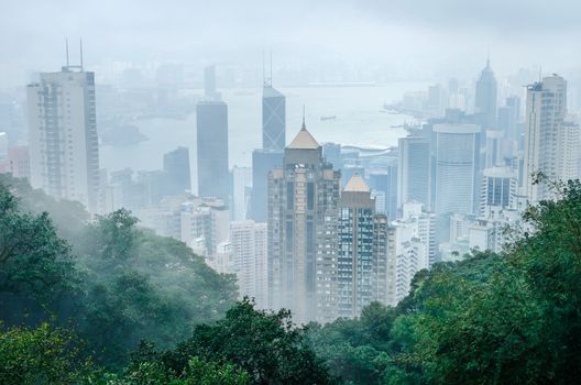 Hong Kong city in fog weather viewed from Victoria Peak, a hill on the western half of Hong Kong Island