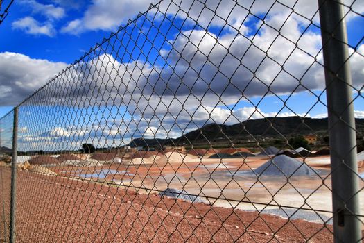 Colorful construction aggregate mountains in Alicante, Spain