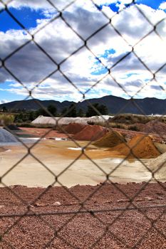 Colorful construction aggregate mountains in Alicante, Spain