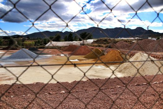 Colorful construction aggregate mountains in Alicante, Spain