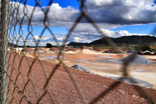Colorful construction aggregate mountains in Alicante, Spain
