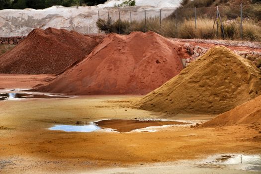 Colorful construction aggregate mountains in Alicante, Spain