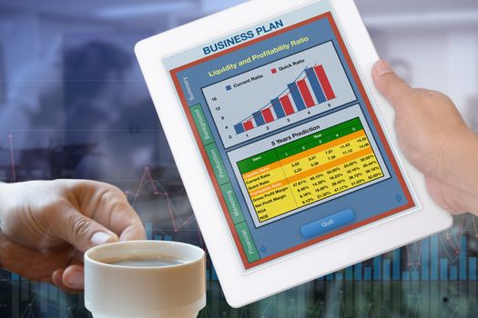 Business plan showing on digital tablet in someone hand.