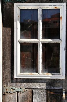 Old and colorful wooden door with iron details in Lisbon, Portugal