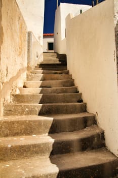 Beautiful narrow streets, white houses and roofs of Azenhas do Mar village in Lisbon, Portugal