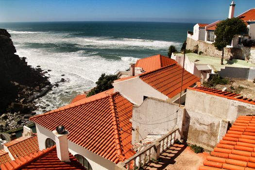 Beautiful narrow streets, white houses and roofs of Azenhas do Mar village in Lisbon, Portugal