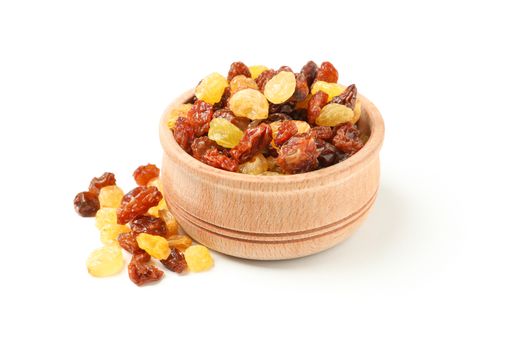 Bowl with raisins isolated on white background
