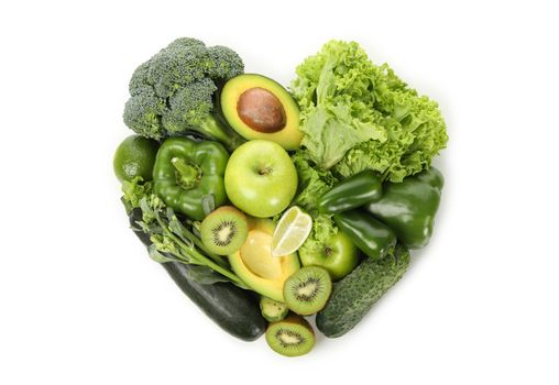 Heart made of vegetables and fruits on white background