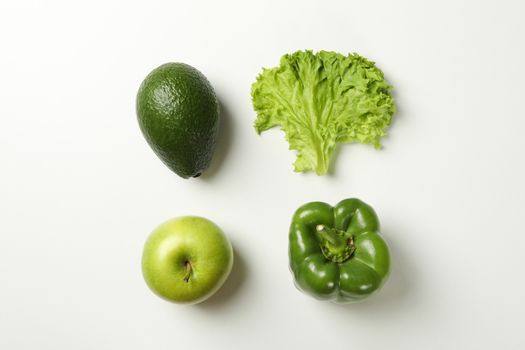 Avocado, apple, salad and pepper on white background