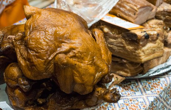 Fresh grilled chicken for sale at the farmers market counter