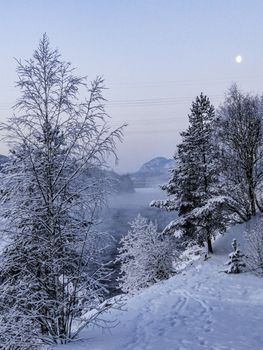 Night and moonlight over the mountains Snow and lakes in wintry Norway.