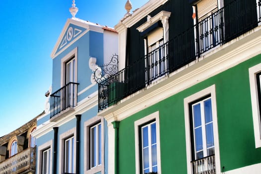 Narrow and colorful streets, majestic facades, windows and balconies of Lisbon, Portugal