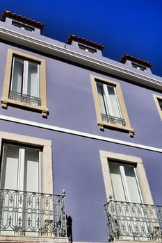 Narrow and colorful streets, majestic facades, windows and balconies of Lisbon, Portugal