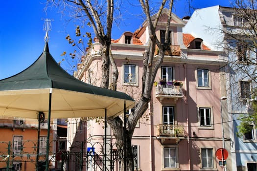 Narrow and colorful streets, majestic facades, windows and balconies of Lisbon, Portugal