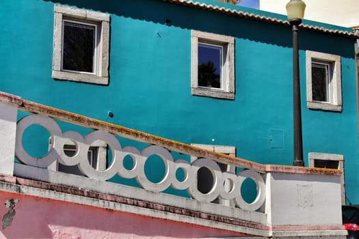 Narrow and colorful streets, majestic facades, windows and balconies of Lisbon, Portugal