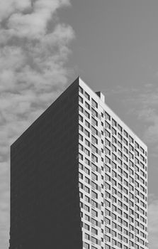 Black and White Skyscraper on the Cloudy Sky Background.