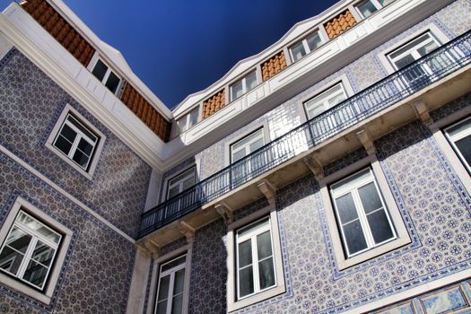 Narrow and colorful streets, majestic facades, windows and balconies of Lisbon, Portugal
