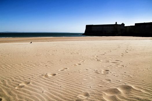 Beautiful beach called Praia da Torre in Lisbon, Portugal, in a sunny day of Spring
