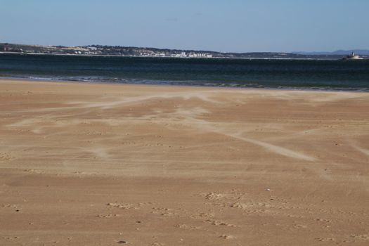 Beautiful beach called Praia da Torre in Lisbon, Portugal, in a sunny day of Spring