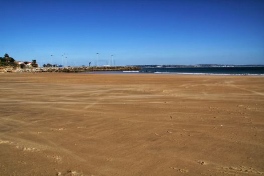Beautiful beach called Praia da Torre in Lisbon, Portugal, in a sunny day of Spring